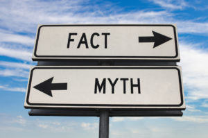 A road sign points in two directions, one for myths and one for facts, emphasizing the importance of understanding bankruptcy myths.